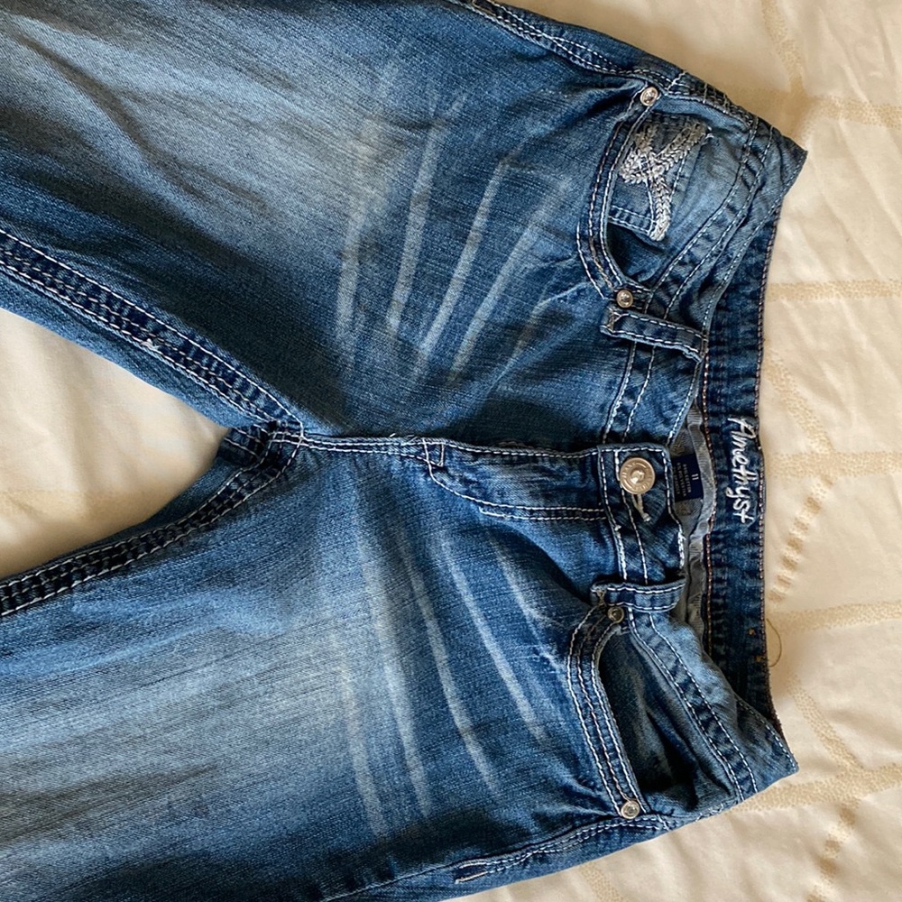 Amethyst Boot leg stone washed jeans.